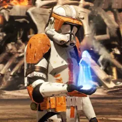 Un clone trooper con armatura arancione tiene un oggetto blu luminoso. Sullo sfondo, rovine e fiamme, un momento chiave dei Clone Wars ordine cronologico.