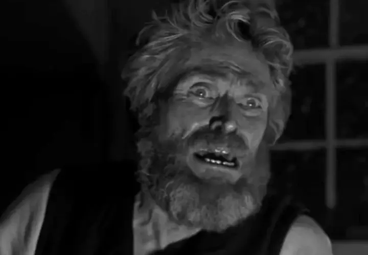 Un uomo con barba e capelli incolti, sguardo folle, forse una spiegazione del lighthouse.