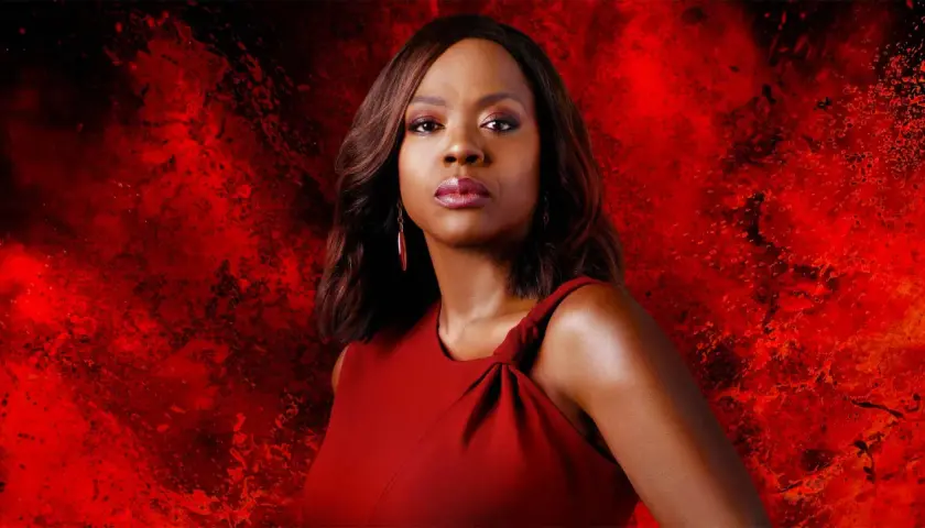 Viola Davis in a red dress against a fiery red background.