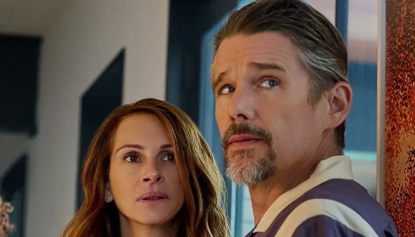 Julia Roberts ed Ethan Hawke, cast de "Il mondo dietro di te", con sguardi preoccupati verso un futuro incerto.