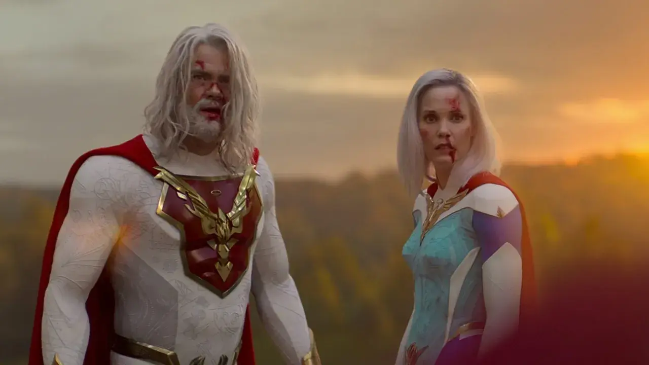 Il cast di Jupiter's Legacy, con volti feriti, guarda verso l'orizzonte al tramonto.
