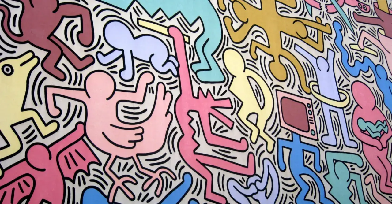 Un'esplosione di figure stilizzate e colorate, un'iconica opera di Keith Haring che celebra la vita e il movimento.