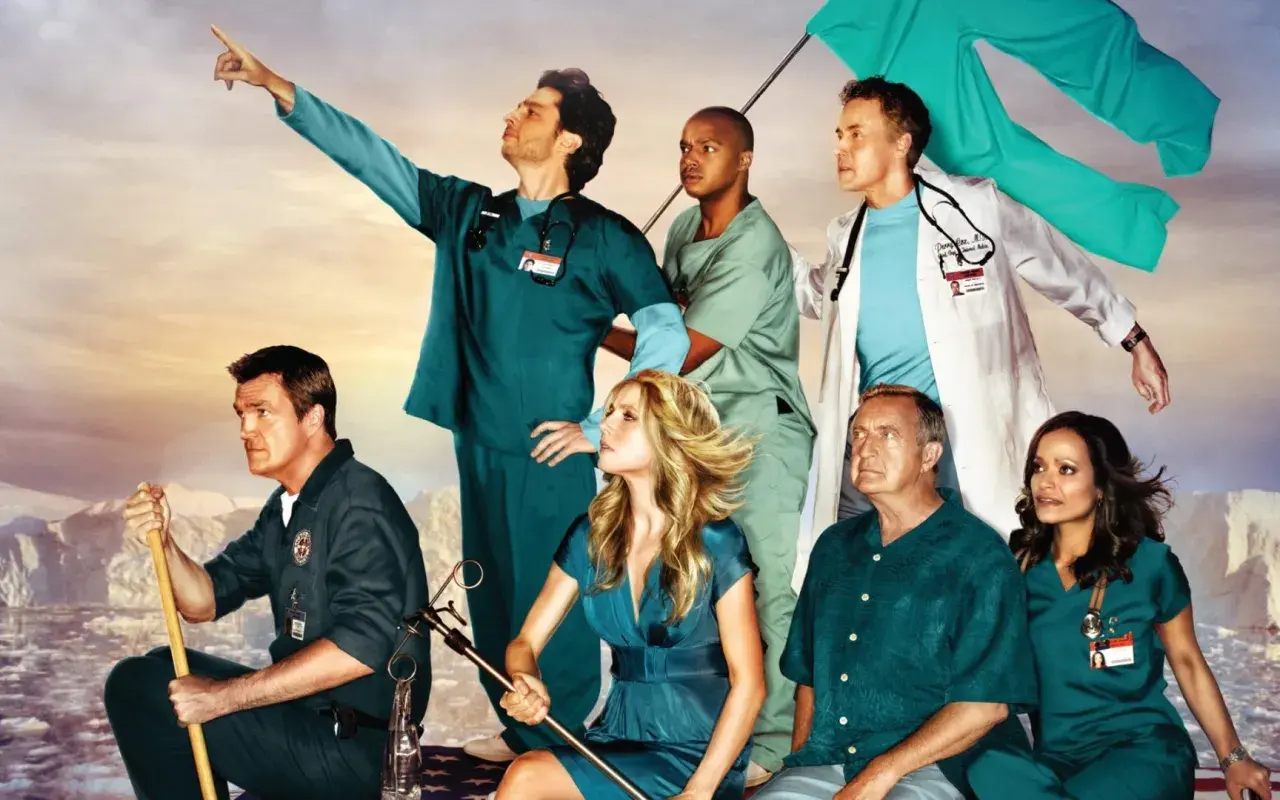 Cast di Scrubs in posa epica, con un medico che indica l'orizzonte. Una recensione di scrubs che cattura lo spirito della serie.