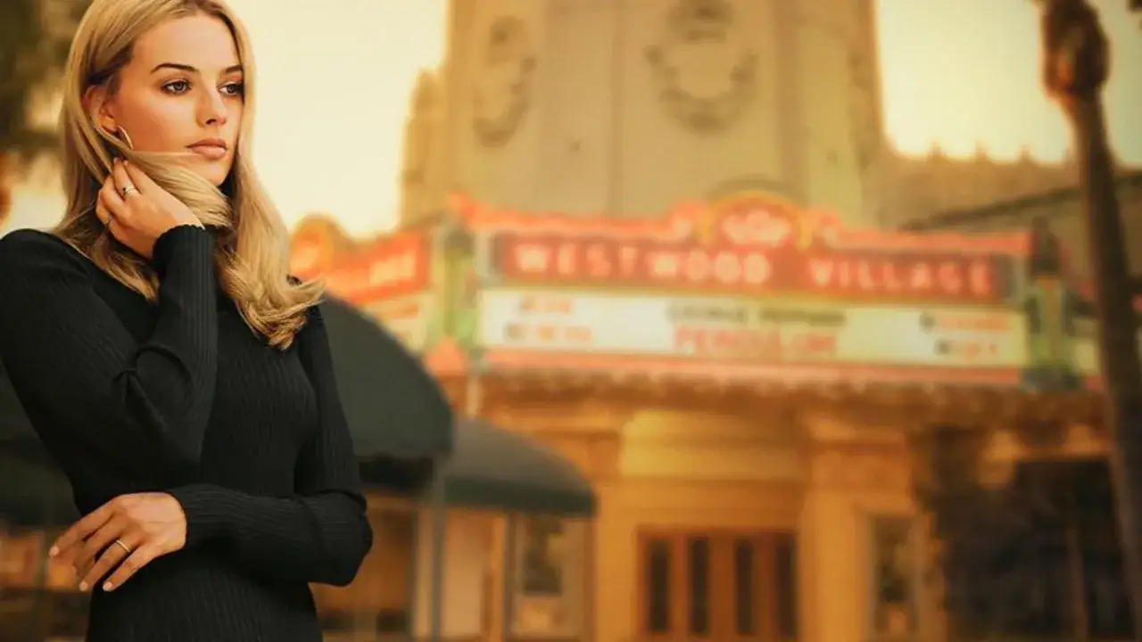 Margot Robbie, icona di stile, posa davanti al Westwood Village, un'immagine che evoca il fascino di